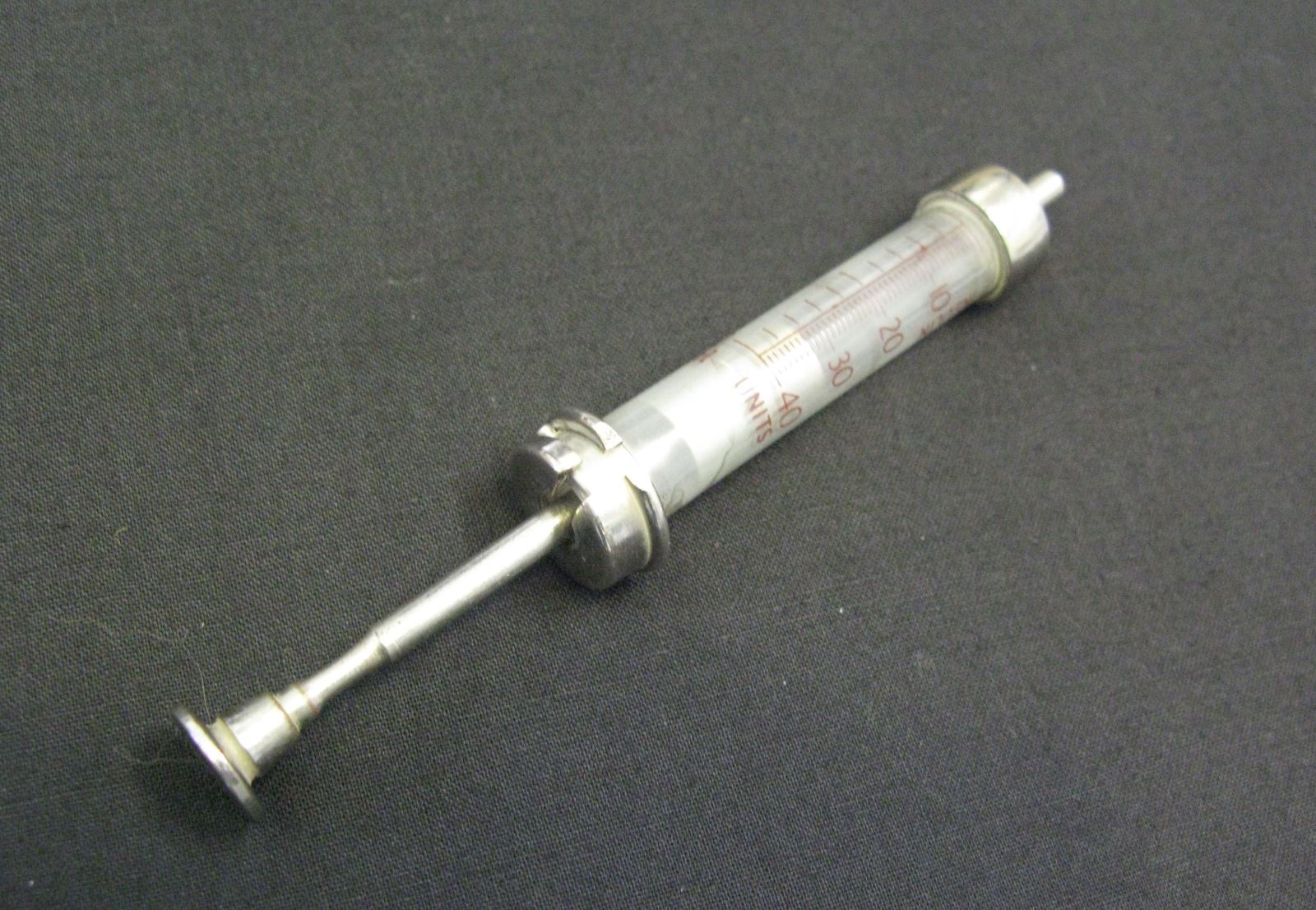 an empty syringe without the needle 